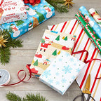 Hallmark Reversible Christmas Wrapping Paper (3 Rolls: 120 sq. ft. ttl) Rustic Santa, Papercraft Snowmen, Candy Canes, Stripes, Snowflakes, "Merry Christmas to You"
