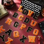 WILLBOND 52 Pcs Chenille Letter Patches Bulk Self Adhesive Letter Patches for Backpacks Stick on Letters Embroidered Applique Patch for Clothing Hats Halloween Christmas Supplies(Black, Orange)
